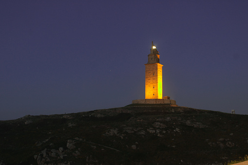 Tower of Hercules at night. Iconic place in the city of A Coruna, in Galicia. Roman lighthouse in A Coruna.