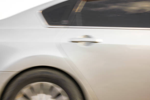 istock Motion blur image of a modern car driving fast. 1358038189