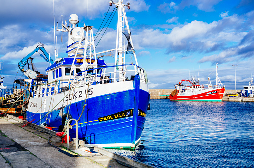 Buckie, United Kingdom: November 19, 2021: Fishing trawler Chloe Ella being unloaded at Buckie harbour in the Moray region of Scotland, UK.