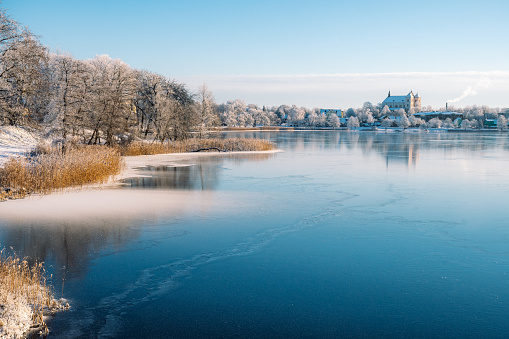 Wonderful winter view of Trakai, Vilnius, Lithuania, Eastern Europe, located between beautiful lakes and nature with frozen lake and snow, postcard