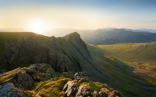 Sunset over Ennerdale Water from Scoat Fell with views of Steeple In the English Lake District, UK.