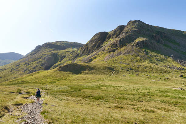 istock Female hiker backpacking with views of Kirk Fell 1358045642