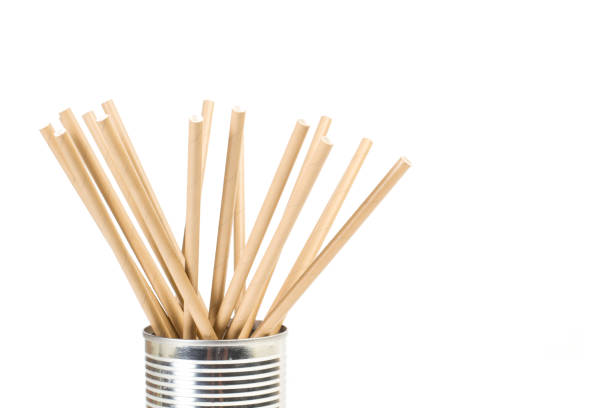 istock Paper straws in a tin can on a white background 1358047443