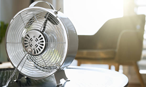 istock Electric air fan rotates at home. 1358047632