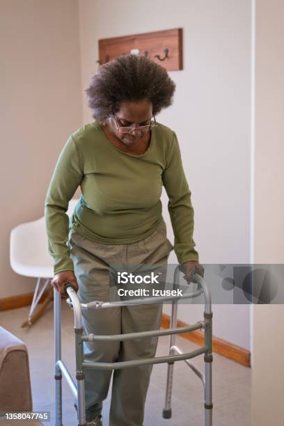 Elderly Woman Walking With Mobility Walker Stock Photo - Download Image Now - Mobility Walker, Domestic Life, Home Interior