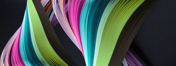 istock Abstract rainbow color wave paper on texture black horizontal long background. 1358047910