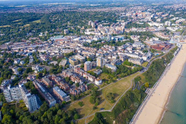 Aerial drone photo of the Bournemouth beach and town centre on a beautiful sunny day showing beach front hotels, guest houses and home by the sea stock photo