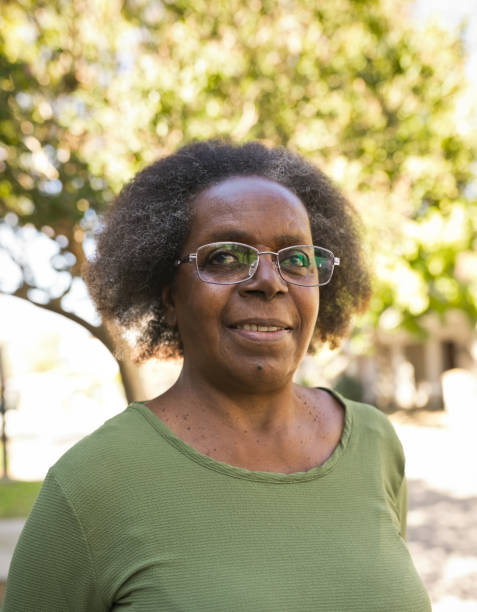 istock Senior woman with eyeglasses looking away 1358049970