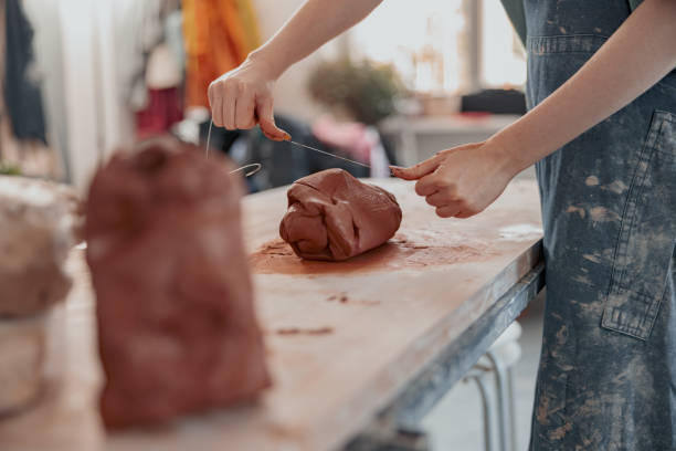 istock Diligent master molding clay product in ceramics workshop 1358050892