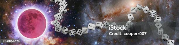 Abstract Image Of A Chain Of Dice On The Background Of A Space Landscape Stock Photo - Download Image Now