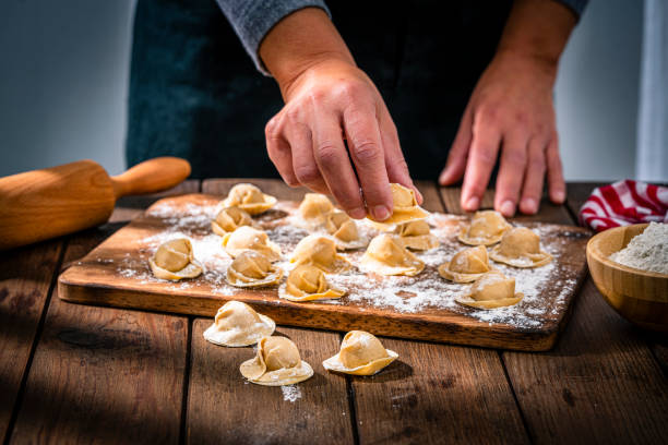 istock Chef holding traditional Italian cappelletti pasta 1358054202