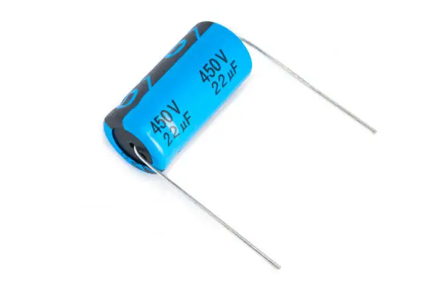 Axial electrolytic capacitor (450v 22uf) isolated on white background