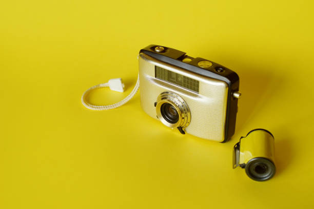 istock Vintage Film Camera On Yellow 1358058414