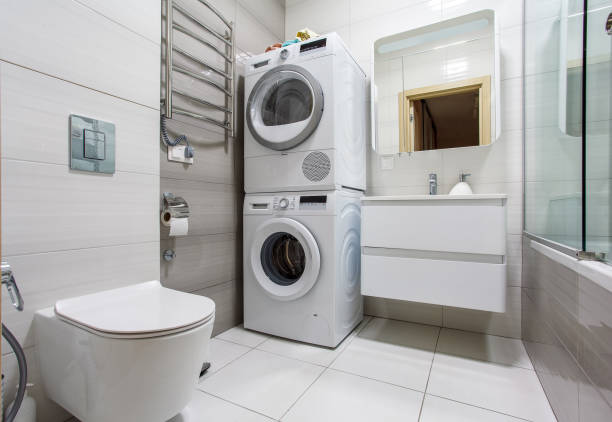 istock A modern bathroom with Laundry space with washing machine and dryer. 1358059480