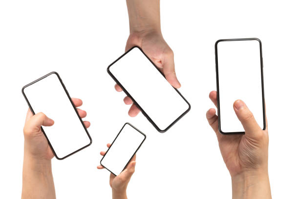 istock Smart phone in man hand isolated on white background.  White screen. 1358061633