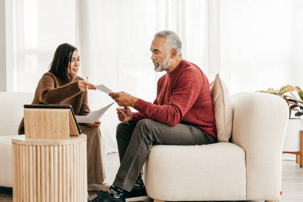 istock Financial advisor meeting with senior client at home 1358061823