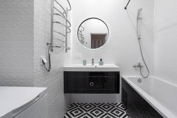 istock A modern bathroom with a black vanity, mirror, and hardware. 1358063145