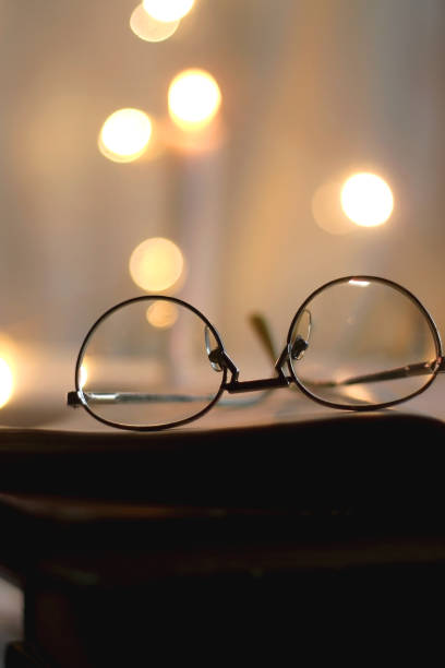 istock Book, Glasses and Candles 1358065285