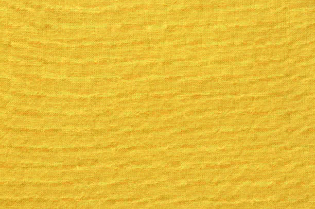 istock Yellow cotton fabric texture background, seamless pattern of natural textile. 1358065339