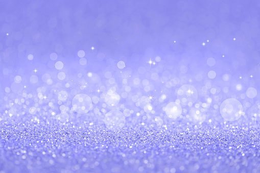 Violet abstract defocused bokeh background. Very peri, color of the year 2022. Colorful concept. Festive sparkling texture.
