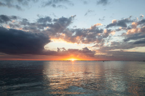istock Aerial panoramic view of sunset over ocean. 1358066471