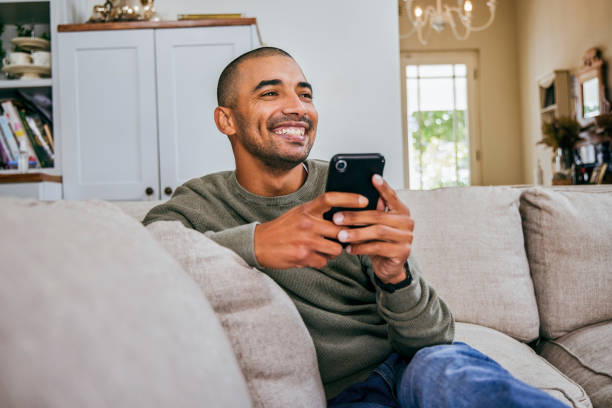istock Shot of a handsome young man using his smartphone to send a text message 1358070533