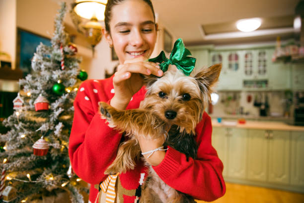 istock Christmas Time With Her Puppy 1358072031