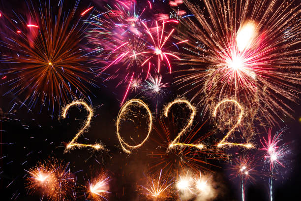 istock 2022 Happy New Year written with Sparkle firework on black background 1358073265
