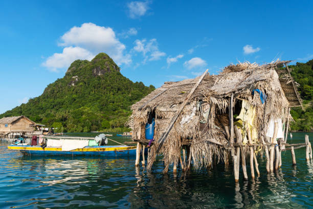 Wooden houses and boats at the Sea Bajau water village in Tatagan Island, Semporna, Sabah, Malaysia stock photo