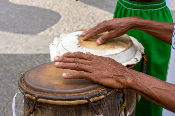 istock Percussionist playing a rudimentary atabaque during afro-brazilian cultural manifestation 1358075558