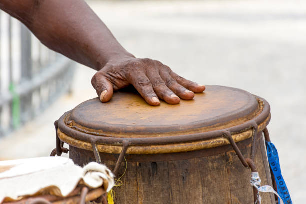 istock Percussionist playing a rudimentary atabaque during afro-brazilian capoeira fight 1358075571