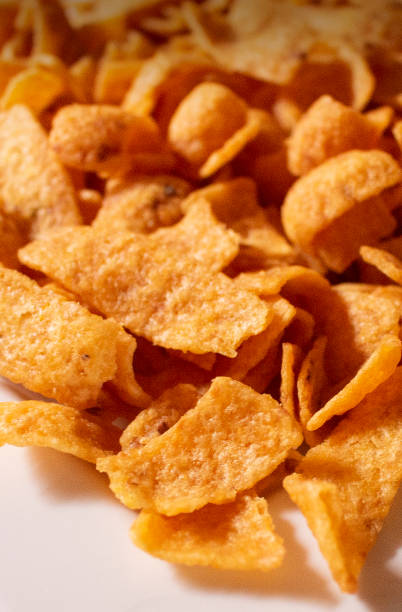 istock vertical perspective view of corn chips snack junk food background 1358079335