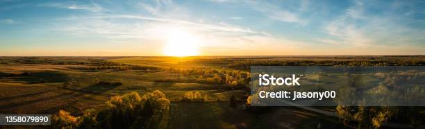 Aerial Panorama Of A Sunset Over The Gentle Rolling Hills Of The Great Plains With Trees In Their Autumn Colors Stock Photo - Download Image Now