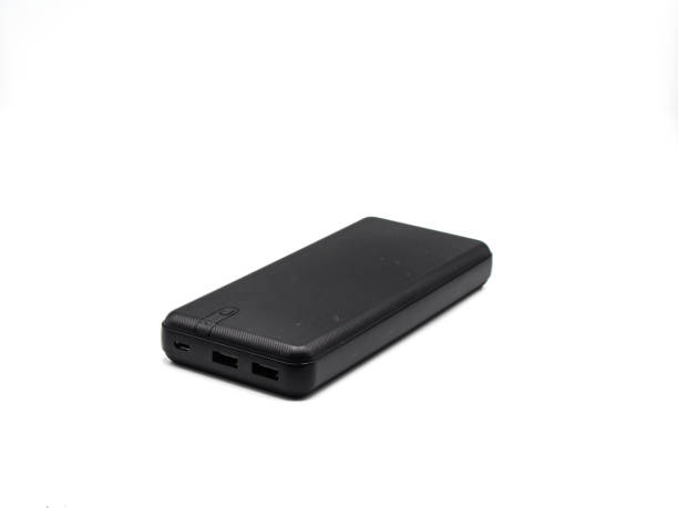 istock Black color power bank on white background 1358080392