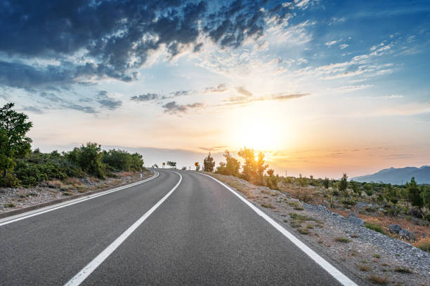 istock Scenic road. Road is surrounded by a magnificent natural landscape. 1358080961