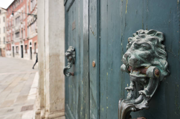 istock An metal old door knocker, Lion head 1358081370