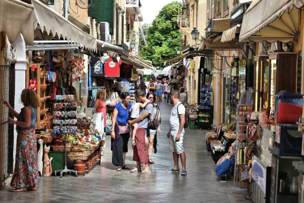 Corfu Town shopping People visit Corfu Town in Greece. The Old Town of Corfu is a UNESCO World Heritage Site. corfu town stock pictures, royalty-free photos & images