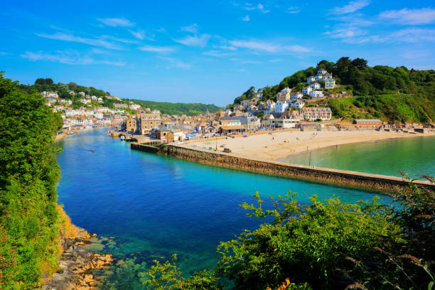Looe Cornwall town and beach and harbour stock photo