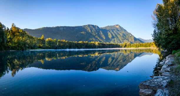 istock Sunrise at a idyllic lake 1358084117