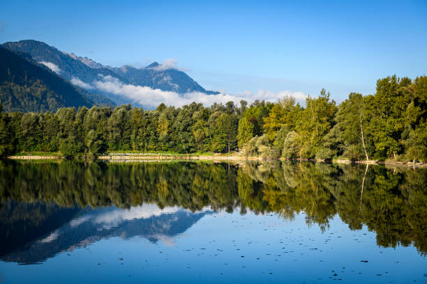 istock Idyllic lake with reflection of the mountains 1358084121