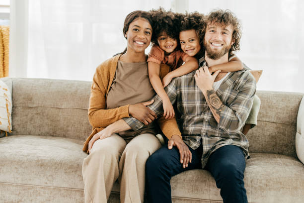 istock Happy kids with smiling parents at home 1358084190
