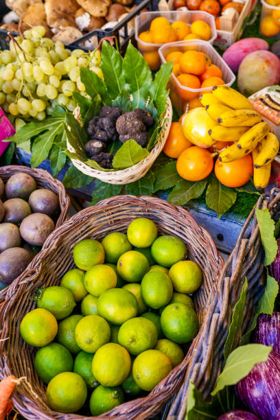 Some natural and healthy varieties of fruits with Lemons and Tangerines Some natural and healthy varieties of fruits with Lemons and Tangerines, typical of the Mediterranean diet. The traditional Mediterranean diet consists of natural, healthy and fresh products, including fruits, vegetables and grains. Image in high definition format. feeding grapes stock pictures, royalty-free photos & images