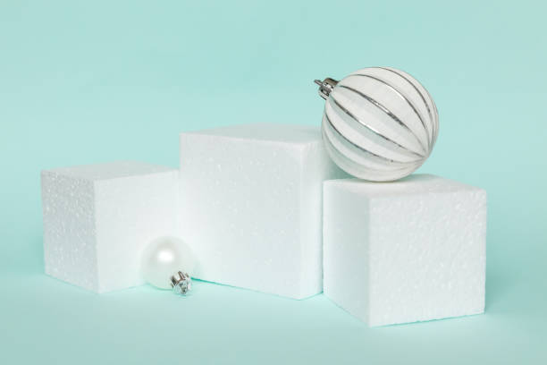 istock Simply minimal composition winter objects ornament and cube shapes geometric form podium isolated blue pastel background. Christmas New Year december time for celebration concept. Mockup, copy space 1358084396