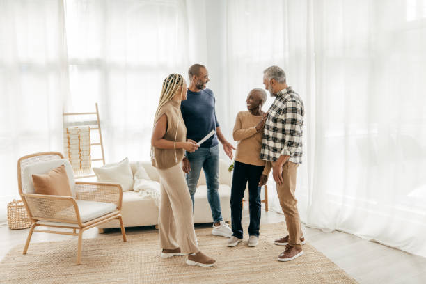istock Senior couple with Real Estate Agent 1358084896