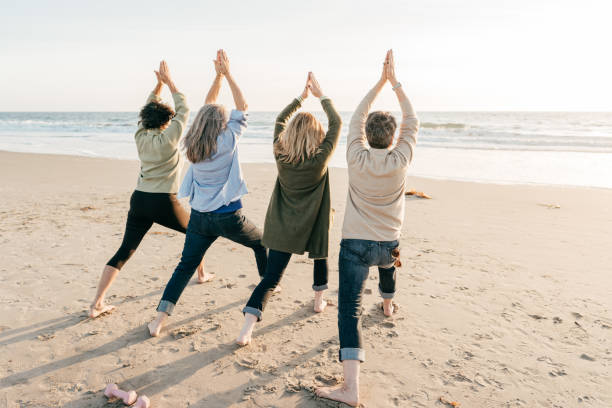 istock Beach yoga for people after 60 1358084912