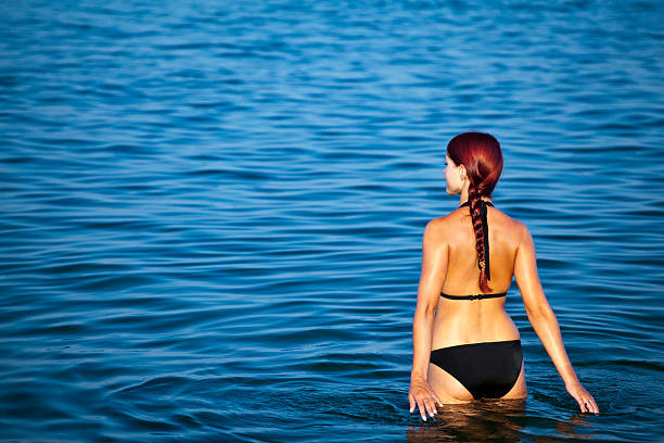 istock Young woman relaxing in sea 135808531