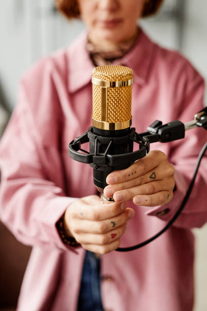 istock Woman Plugging in Microphone 1358087434