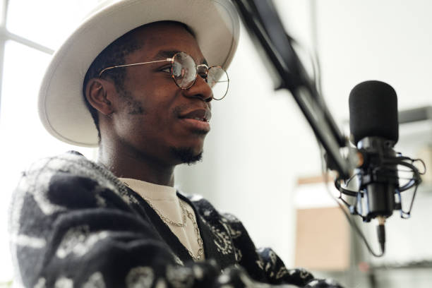 istock Creative African American Man Speaking to Microphone 1358087510
