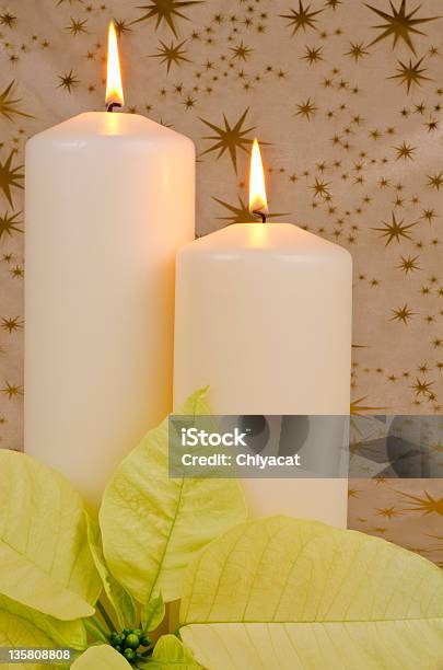 Christmas Candles With White Poinsettia Stock Photo - Download Image Now - Beige, Burning, Candle