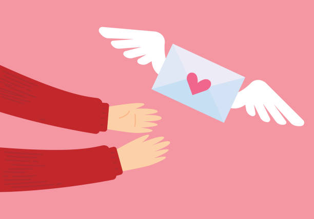 istock Love Letter. Hands holding a envelope and heart shape. Valentine's day concept 1358088115